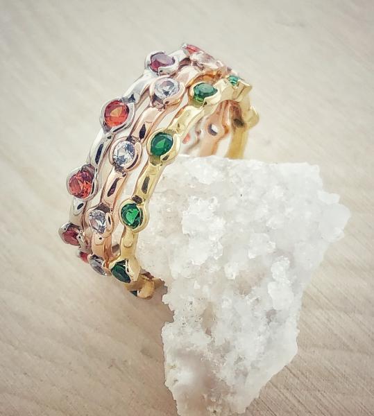 18 karat white, rose and yellow gold stacking rings with orange sapphires, white sapphires and green chrome tourmaline.  $1960.00***SOLD***