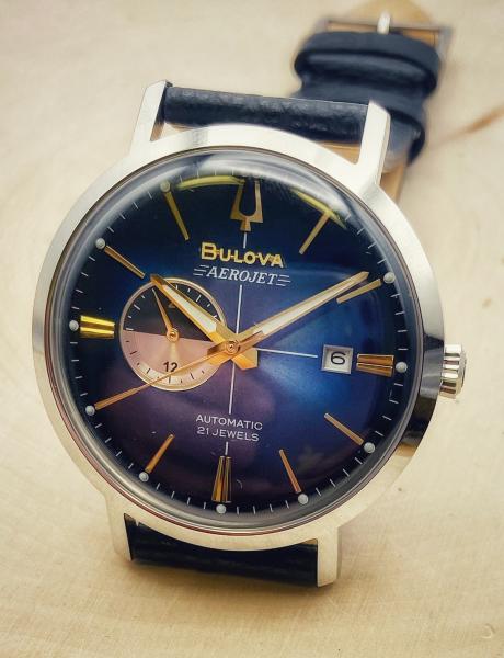 Stainless steel Bulova Aerojet automatic with a leather strap. $495.00