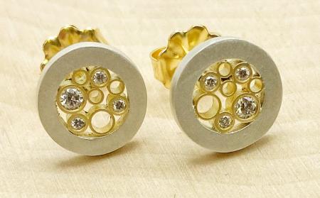 Sterling silver and 18 karat gold diamond circle stud earrings. $1250.00