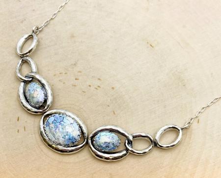 Sterling silver Roman glass oval link necklace. $810.00