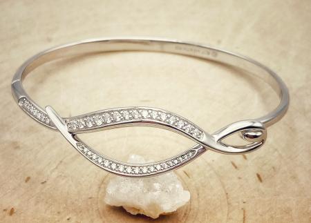 Sterling silver entwined cubic zirconia bangle bracelet. $275.00