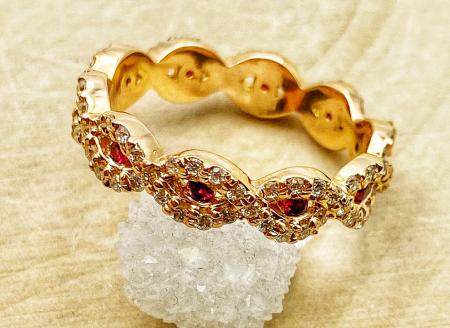 18 karat rose gold ruby and diamond eternity ring. $2,450.00