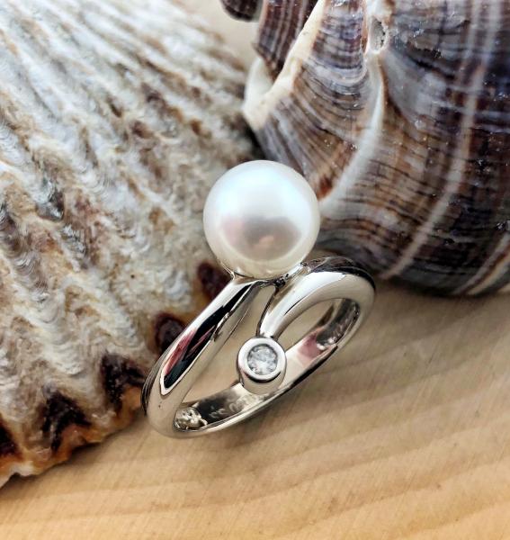 Sterling silver ring with an 8mm Akoya cultured pearl and a brilliant cut accent diamond. *Sold, please inquire about special ordering*