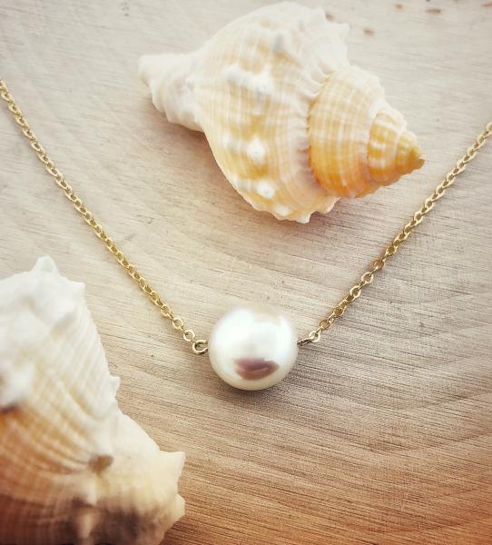 14 karat yellow gold 16" necklace with a 10mm cultured freshwater coin pearl. *Sold, please inquire about special ordering*