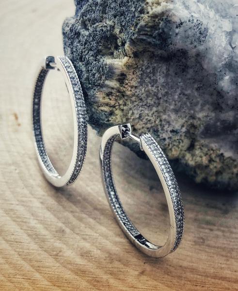 14 karat white gold inside-out diamond hoops totaling 0.25 carat. $1196.00