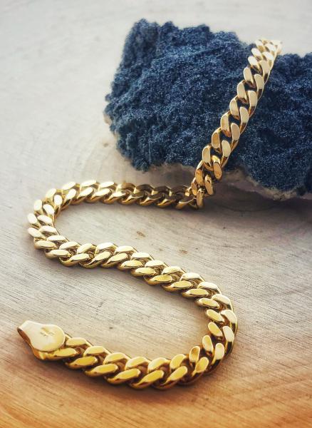 14 karat yellow gold solid curb link bracelet. $1900.00 - Online sale price= $1400.00