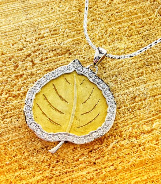 Sterling silver and 18 karat yellow gold overlay diamond Aspen leaf. $700.00
**2 week delivery**