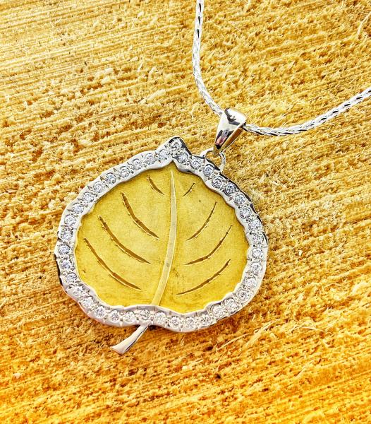 Sterling silver and 18 karat yellow gold overlay diamond Aspen leaf. $700.00
**2 week delivery**