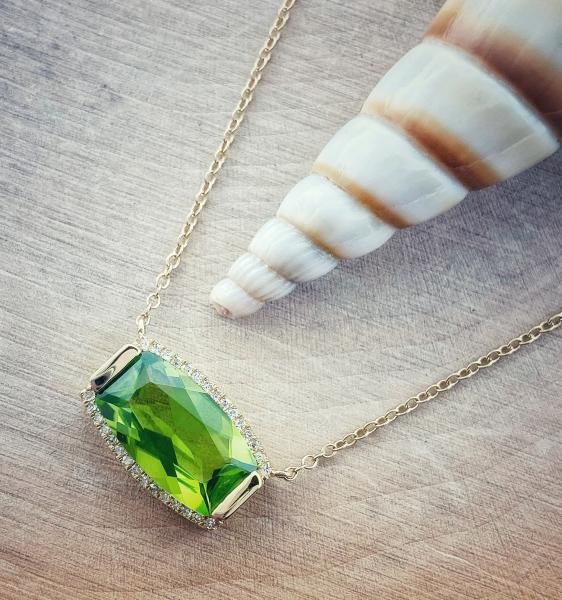 14 karat yellow gold custom cut peridot and diamond necklace. $1195.00