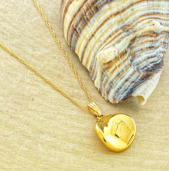 14 karat yellow gold concave button style pendant and chain. $420.00