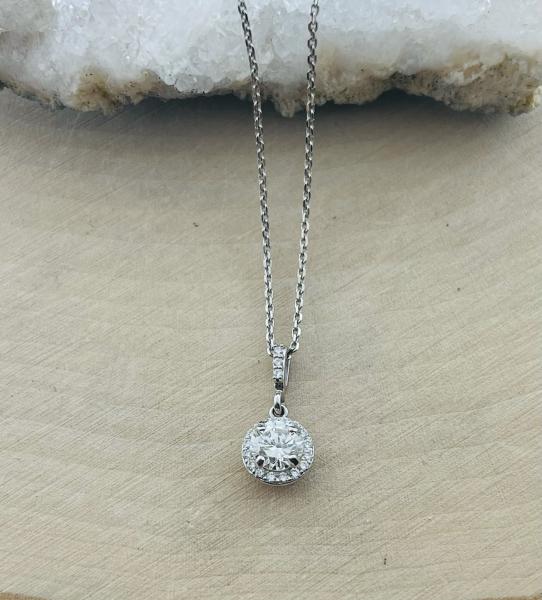 14 karat white gold .53 carat round brilliant diamond VS2/GH halo .10ctw low profile  pendant. $2500