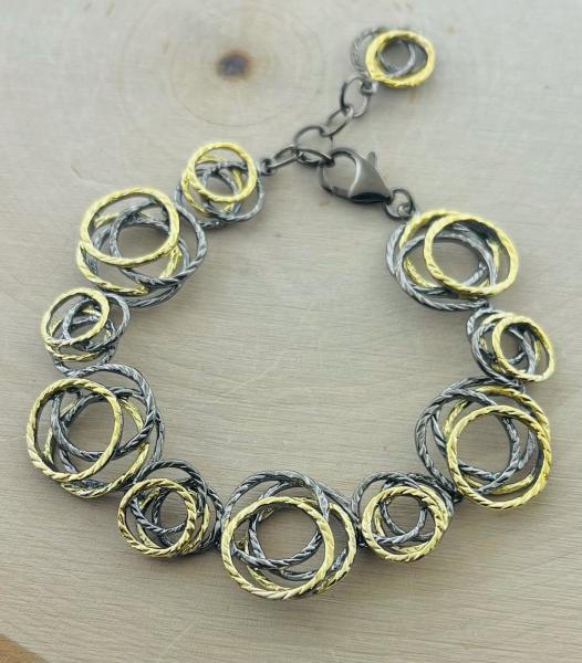 Sterling silver, ruthenium and yellow gold vermeil nest style bracelet. $470.00