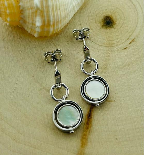 Sterling silver round mother of pearl "Eclipse" spinner drop earrings.  $140.00