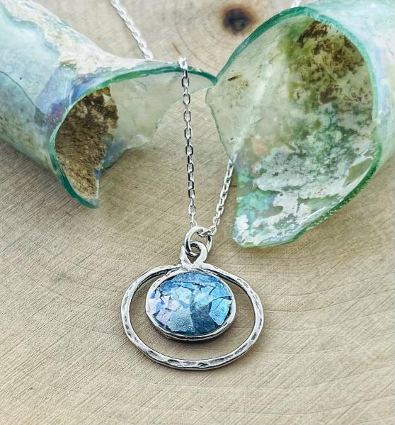 Sterling silver roman glass oval eclipse pendant on chain.  *Currently out of stock*