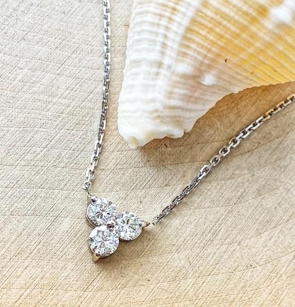 14 karat white gold 3 diamond necklace totaling 0.50 carat. $1600.00