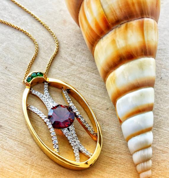 2.35 carat concave cut Mozambique garnet, brilliant cut diamonds and chrome green tourmaline necklace fashioned in 18 karat yellow gold. Designed by Kurt Rose.  $3400.00 Limited design, 2 of 5.