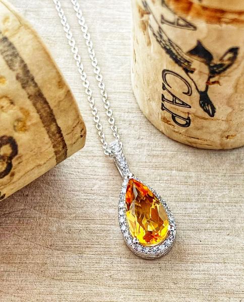 0.84 carat pear shape citrine and diamond halo necklace. $750.00
