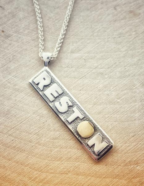 Sterling silver Reston necklace with a gold  "O". $150.00 - - 50% of every purchase goes to the Reston Museum.