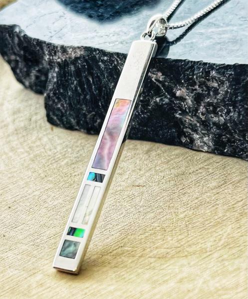 Sterling silver abalone, grey and white mother of pearl bar pendant on chain.  $169.00
