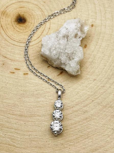 14 karat white gold lab grown diamond 1.00ctw 3-stone pendant on chain. $1995.00 