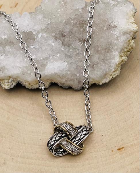 Sterling silver, 18 karat yellow gold diamond love knot necklace. $400.00