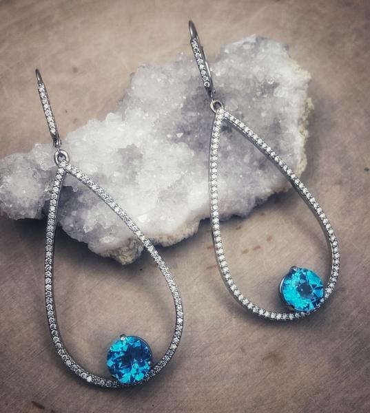 18 karat white gold teardrop earrings with checkerboard Swiss blue topaz totaling 5.0 carats and 190 brilliant cut lab grown diamonds totaling 1.14 carats. Designed by Kurt Rose. $3950.00