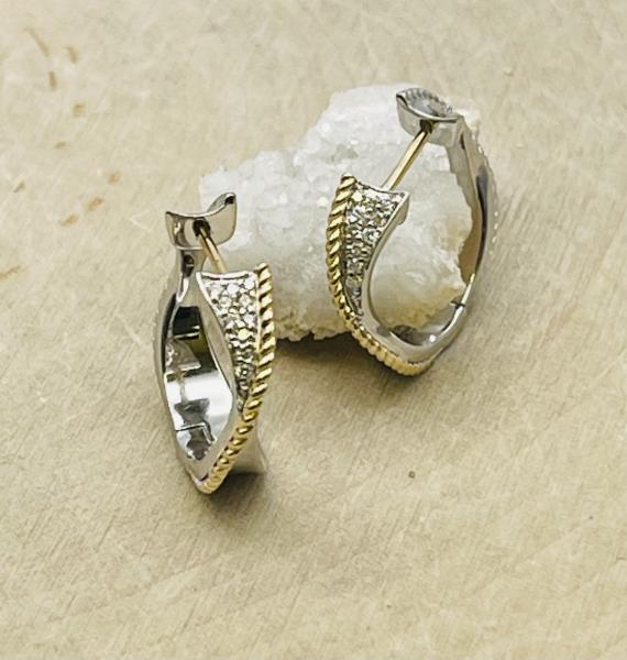 Sterling silver, 18K yellow gold, diamond twist hoop earrings. $500.00