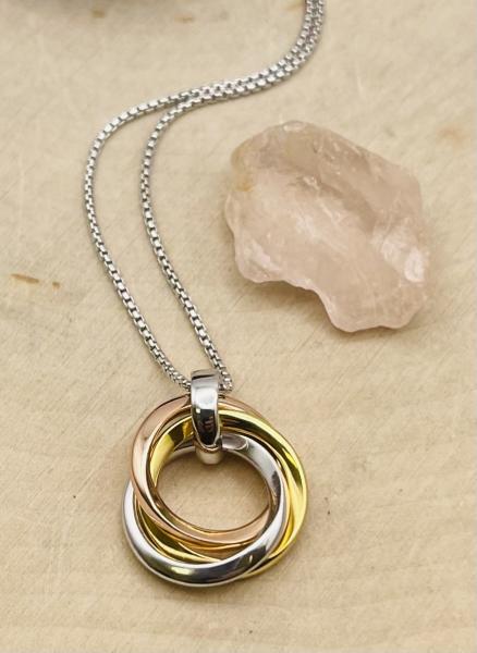 Sterling silver yellow & rose gold vermeil Cirque Trilogy necklace. $210.00