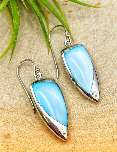 Sterling silver blue mother of pearl zirconia dangle earrings. $185.00