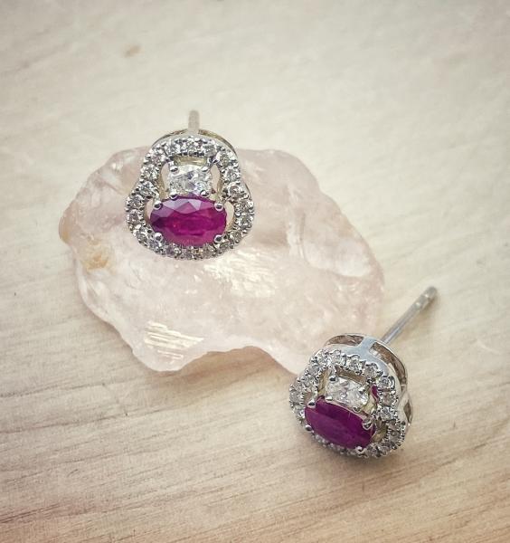 14 karat white gold ruby and diamond earrings. $2850.00