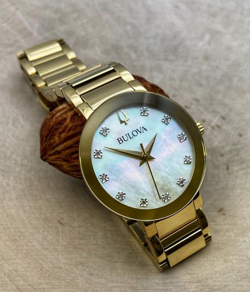 Gold tone stainless steel mother of pearl ladies Bulova Futuro watch. $450.00