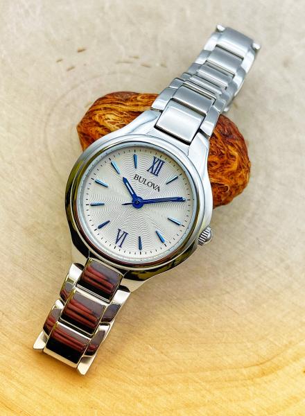 Stainless steel ladies Bulova watch with blue markers. $225.00