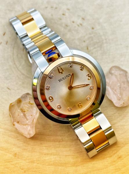 Two tone stainless steel/ rose gold plate diamond ladies Bulova watch. $650.00