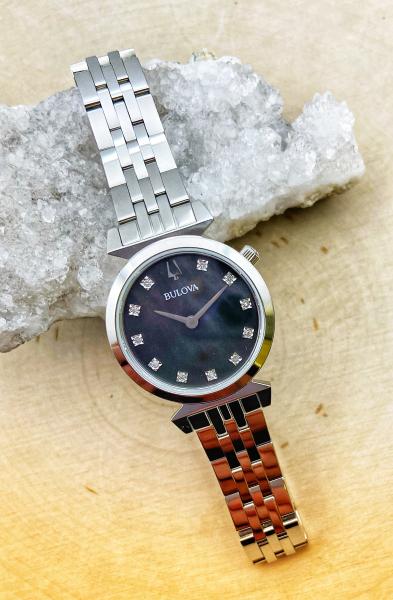 Stainless steel black mother of pearl diamond ladies Bulova watch. $450.00