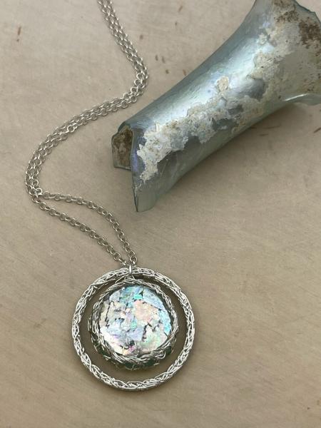 Sterling silver circle roman glass orb wire nest pendant on chain. $425.00