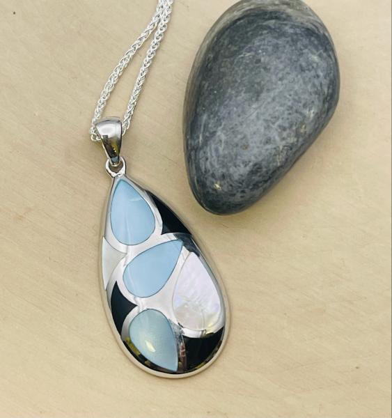 Sterling silver pear shape inlay mother of pearl, blue mother of pearl, onyx drop pendant on chain. $243.00