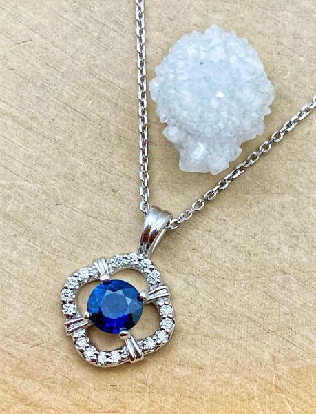 14 karat white gold blue sapphire and diamond necklace. $2,107.00