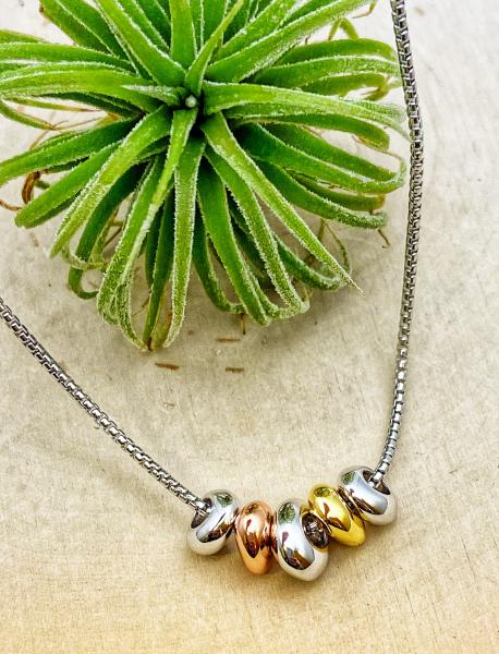 Sterling silver, yellow and rose gold overlay pebble necklace. $190.00