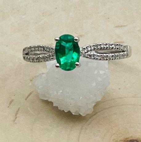14 karat white gold oval emerald and diamond ring. $1015.00