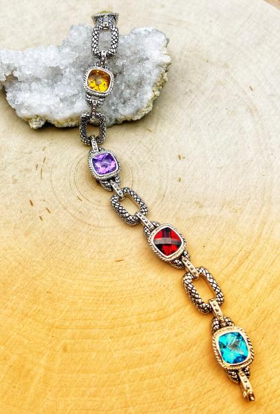 Sterling silver Swiss blue topaz, garnet, amethyst, citrine and prasiolite bracelet. $625.00