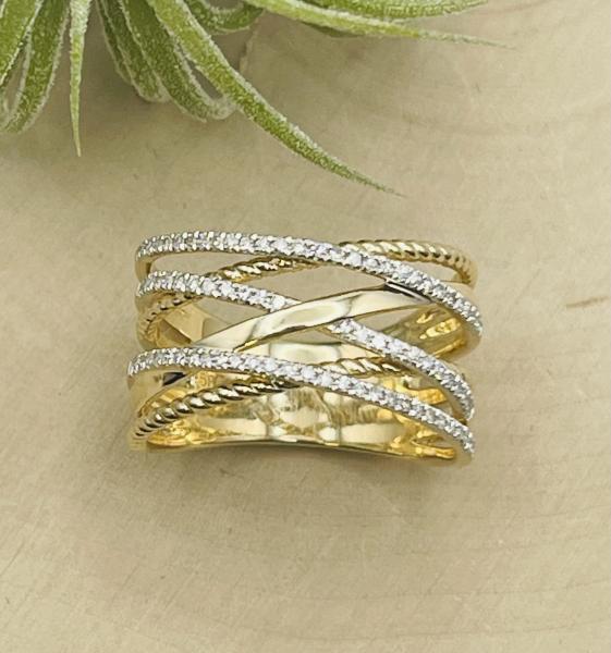 14 karat yellow & white gold diamond criss-cross ring. $2110.00