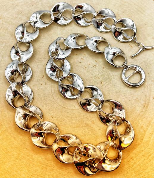 Sterling silver love swirl link necklace. $1250.00