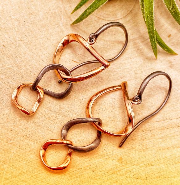Sterling silver, 18 karat rose gold and ruthenium vermeil 3 link dangle earrings. $258.00