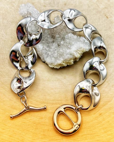 Sterling silver love swirl link bracelet. $695.00