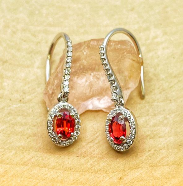 14 karat white gold red sapphire halo earrings. $2025.00