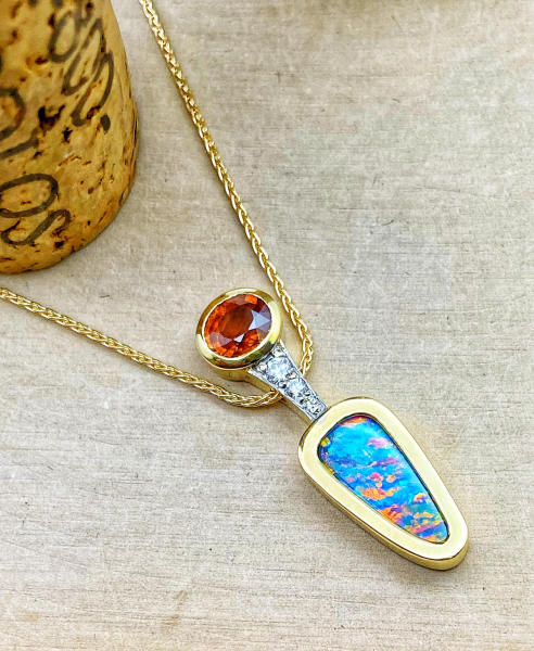 18 karat yellow gold boulder opal doublet, orange sapphire and diamond necklace. $1490.00 **Sold**