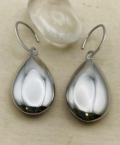 Sterling silver puffed pear shape dangle earrings. $125.00