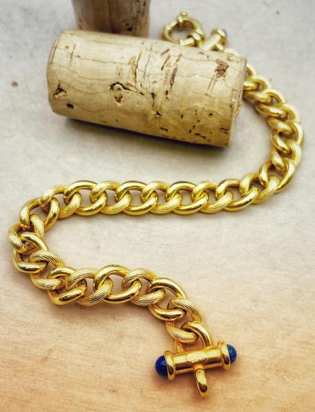 14 karat yellow gold curb link bracelet with lapis accents. $1455.00