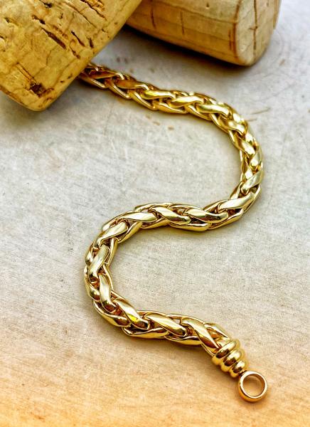 14 karat yellow gold wheat link bracelet. $1380.00