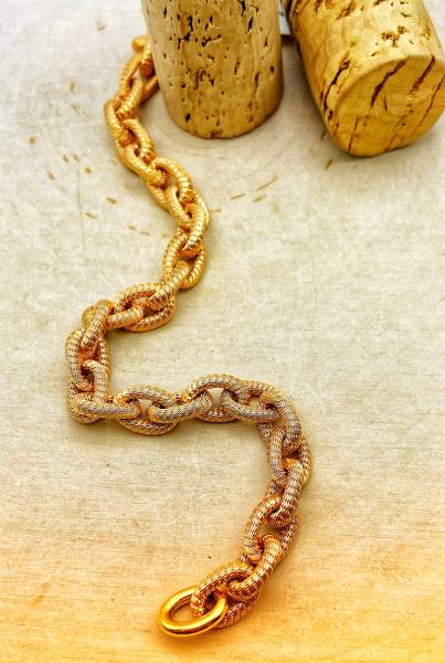 18 karat rose gold textured hollow cable link bracelet. $1895.00